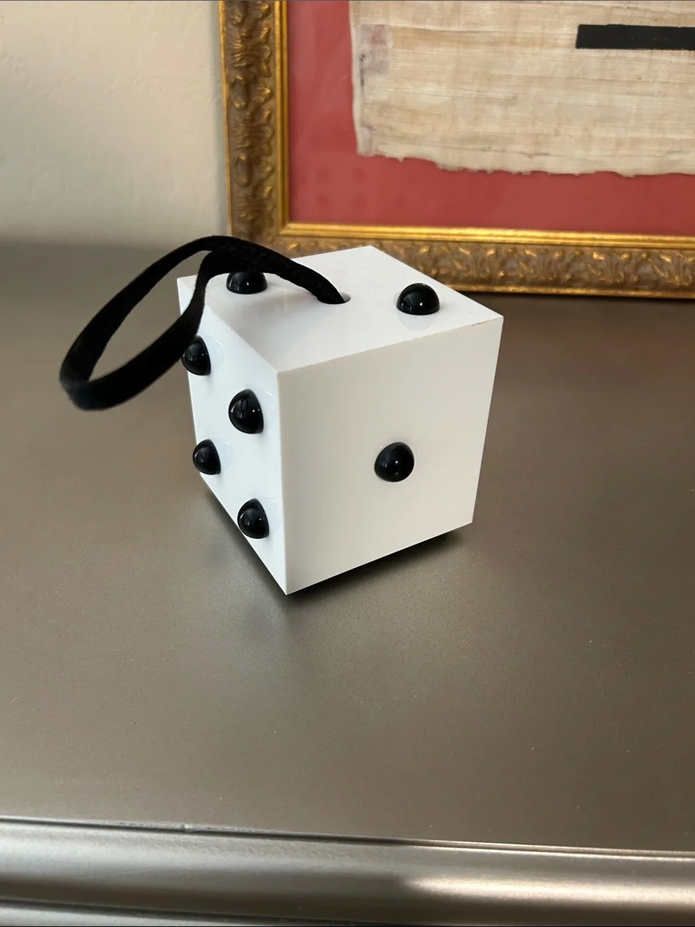 Lulu Guinness wristlet that looks like a dice cube.